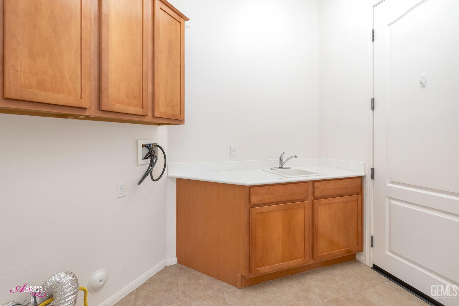 Undisclosed Address Bakersfield, CA 93306 - Photo 21 of 51 a bathroom with a sink and a mirror