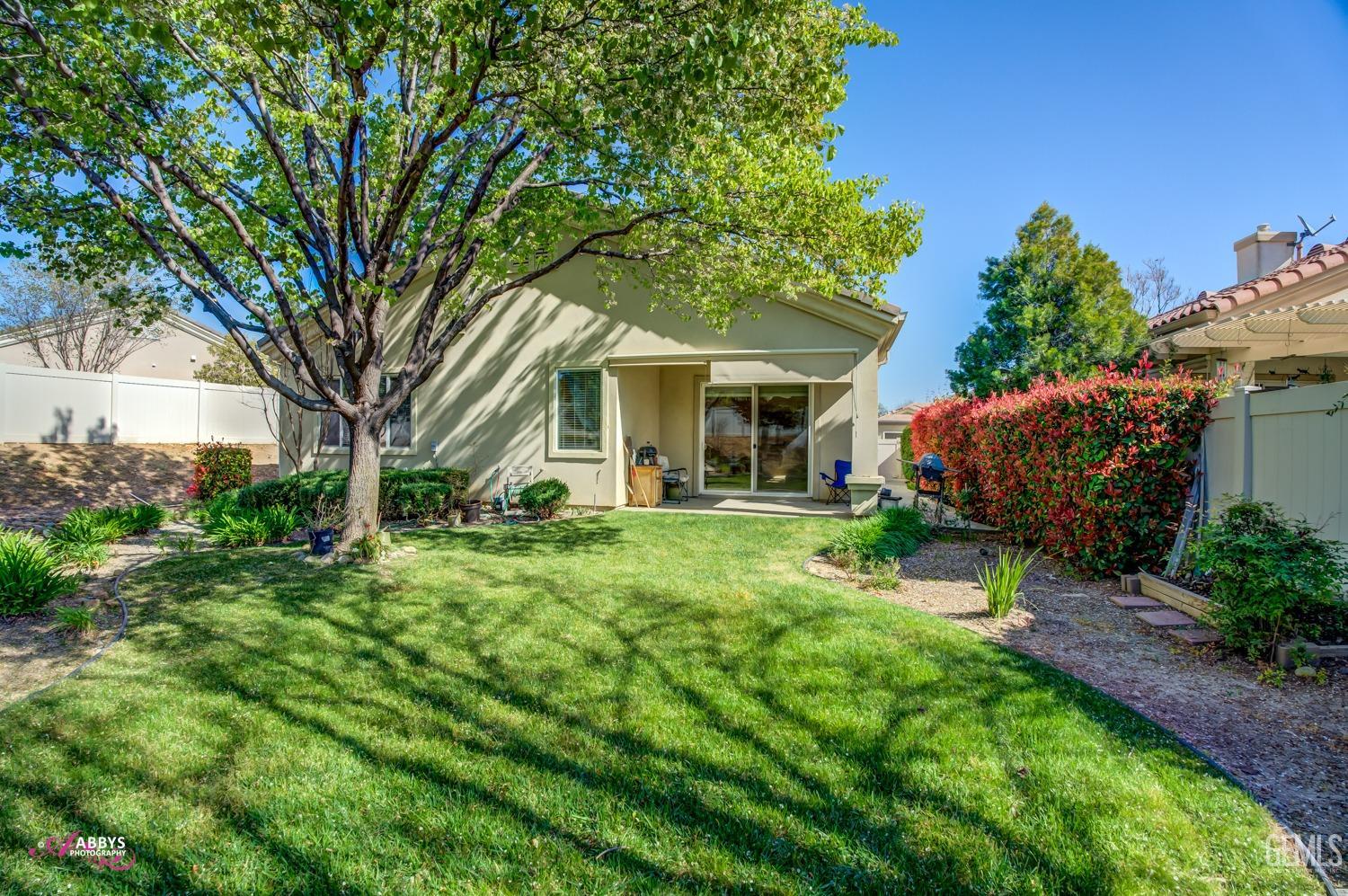 Undisclosed Address Bakersfield, CA 93306 - Photo 23 of 51 a view of a house with a backyard