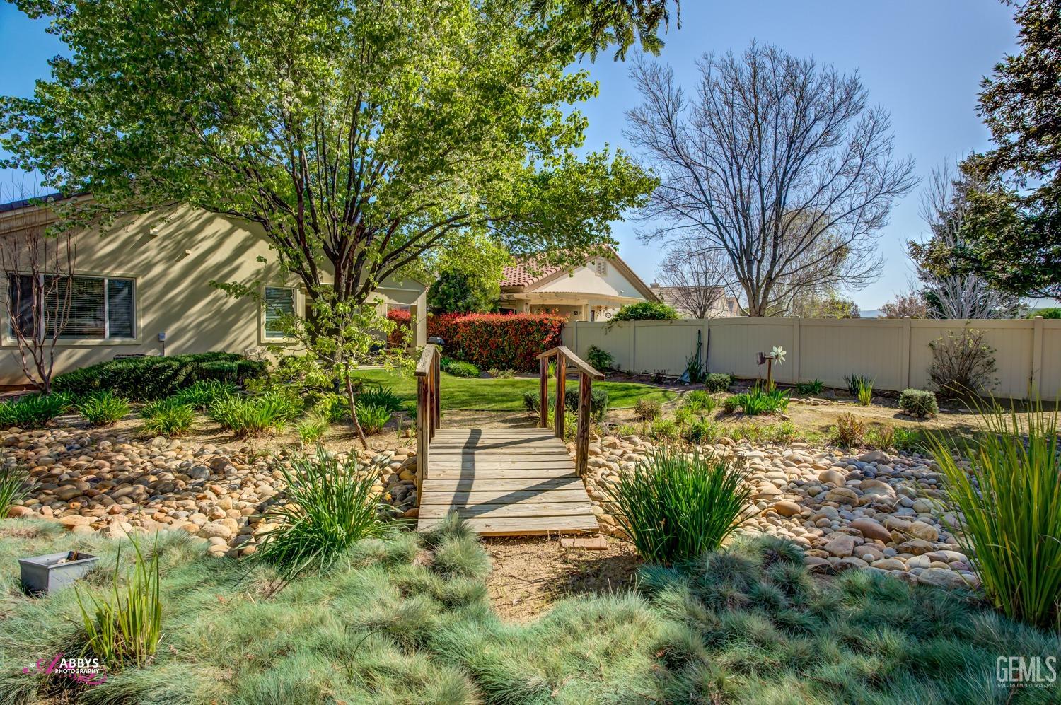 Undisclosed Address Bakersfield, CA 93306 - Photo 31 of 51 a front view of a house with a yard
