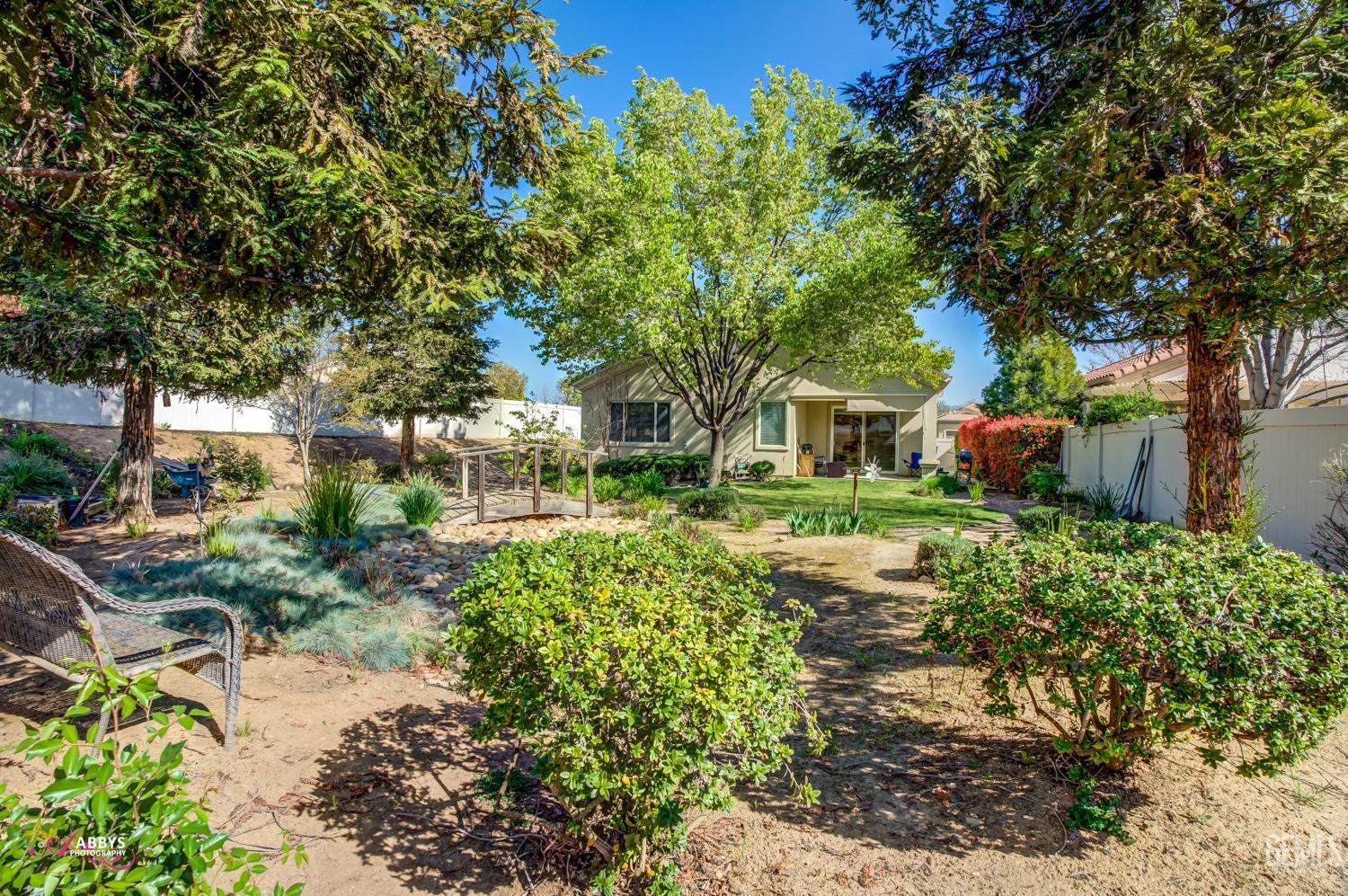Undisclosed Address Bakersfield, CA 93306 - Photo 32 of 51 a front view of a house with a yard