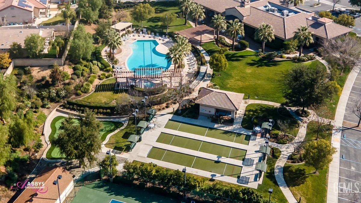 Undisclosed Address Bakersfield, CA 93306 - Photo 41 of 51 an aerial view of residential houses with outdoor space and swimming pool