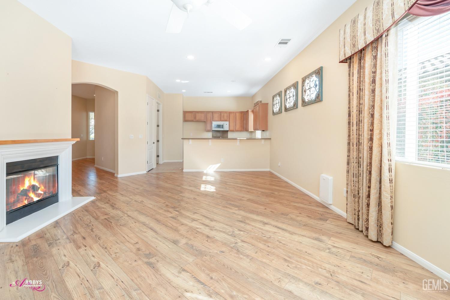 Undisclosed Address Bakersfield, CA 93306 - Photo 9 of 51 a view of empty room with wooden floor