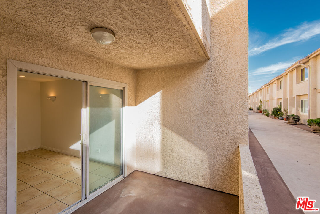 7651 Reseda Boulevard, Unit 3T Reseda, CA 91335 - Photo 11 of 32 a view of a hallway with front door