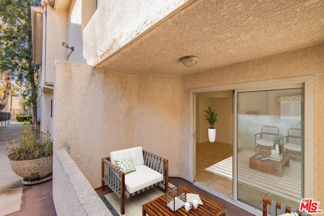 7651 Reseda Boulevard, Unit 3T Reseda, CA 91335 - Photo 12 of 32 a living room with furniture and a potted plant