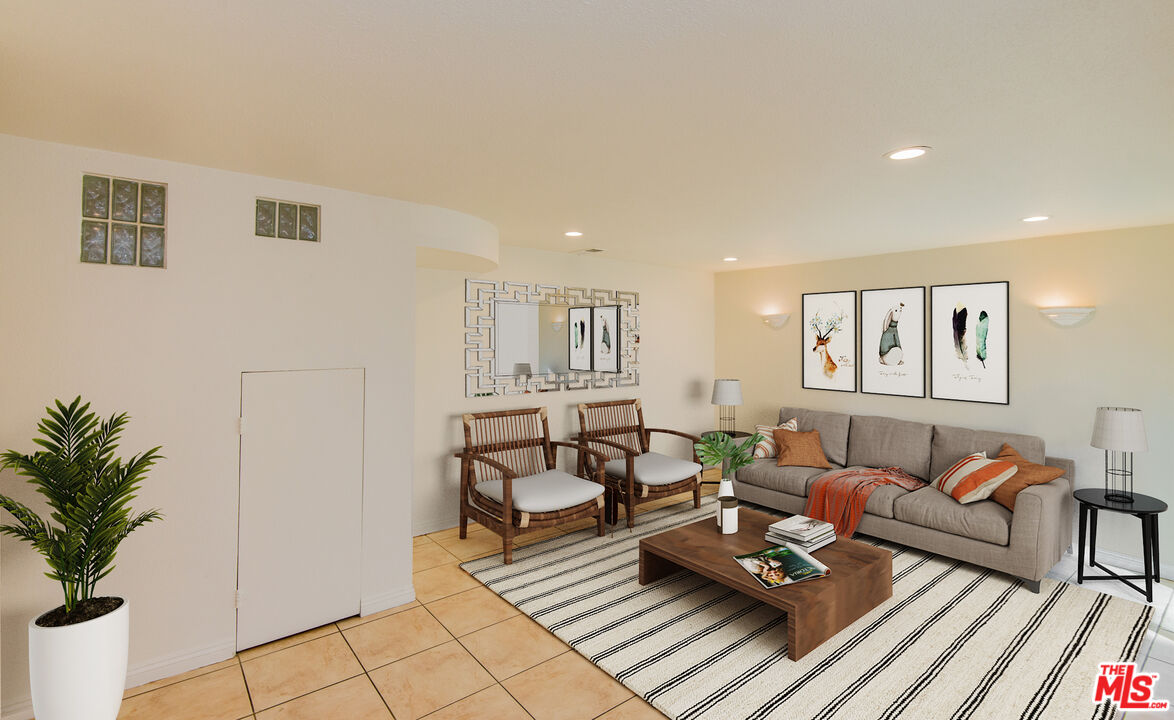 7651 Reseda Boulevard, Unit 3T Reseda, CA 91335 - Photo 15 of 32 a living room with furniture and wooden floor