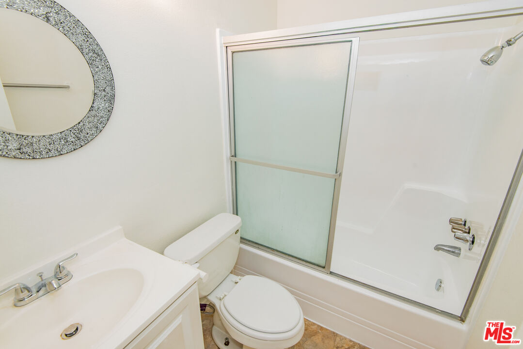 7651 Reseda Boulevard, Unit 3T Reseda, CA 91335 - Photo 19 of 32 a white toilet sitting next to a bathroom sink