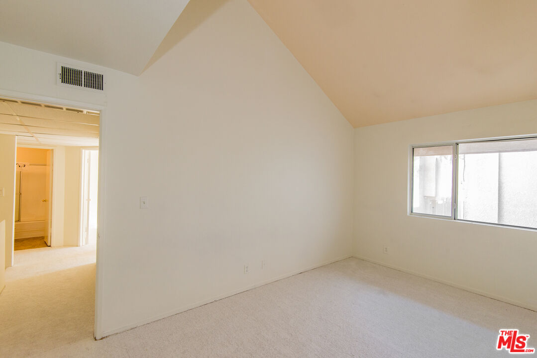 7651 Reseda Boulevard, Unit 3T Reseda, CA 91335 - Photo 25 of 32 an empty room with a windows
