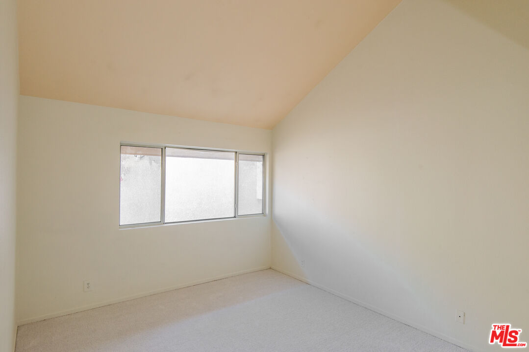 7651 Reseda Boulevard, Unit 3T Reseda, CA 91335 - Photo 28 of 32 an empty room with a window