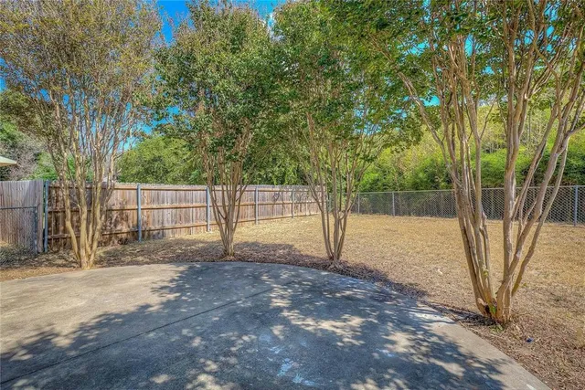 a house view with a backyard space