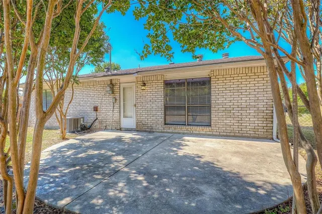a view of a backyard with a trees