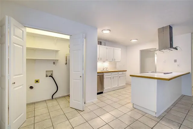 a kitchen with granite countertop a sink and a stove top oven