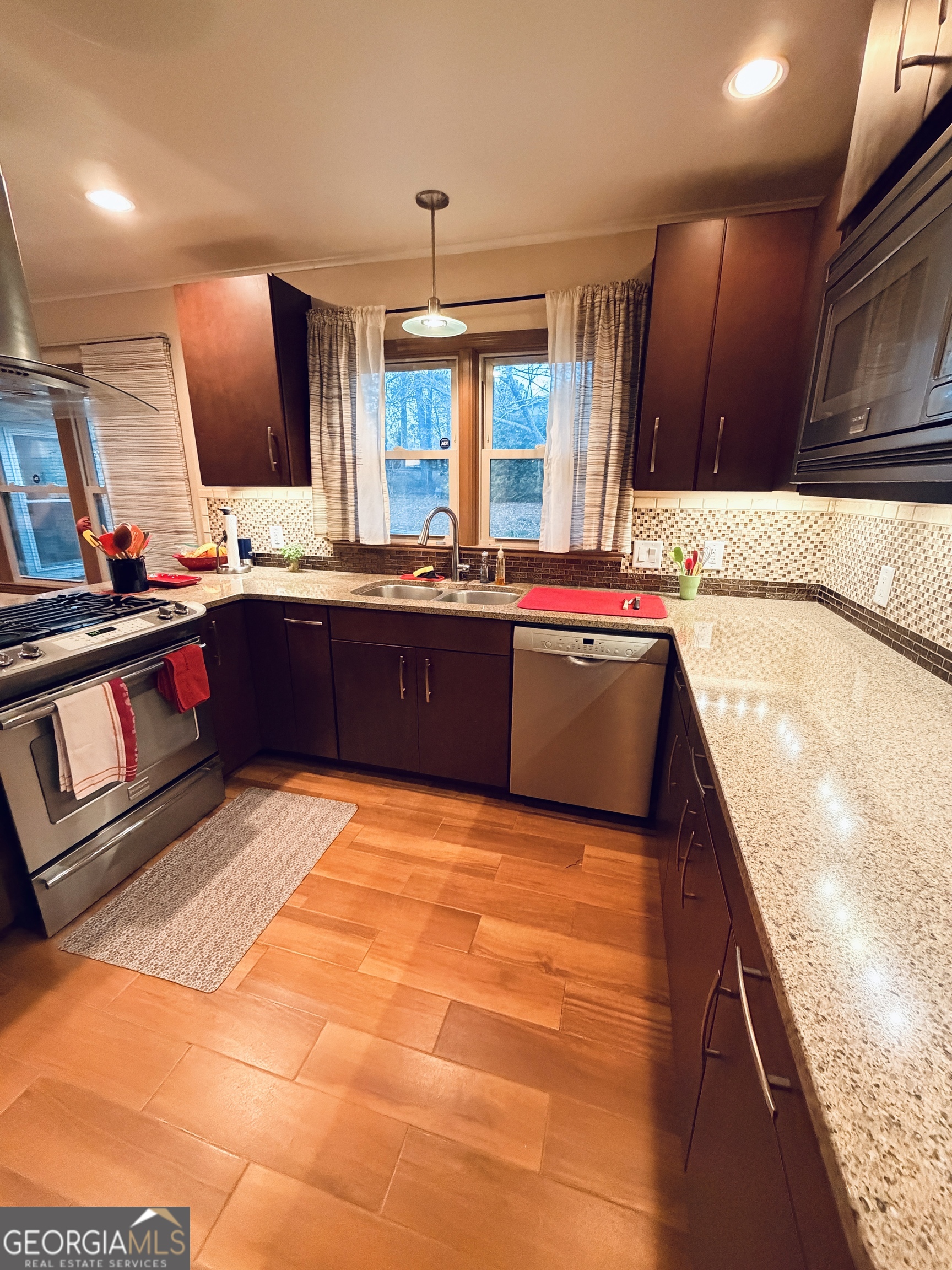 1701 Cedarwood Road Milledgeville, GA 31061 - Photo 11 of 40 a large kitchen with kitchen island a sink stainless steel appliances and cabinets