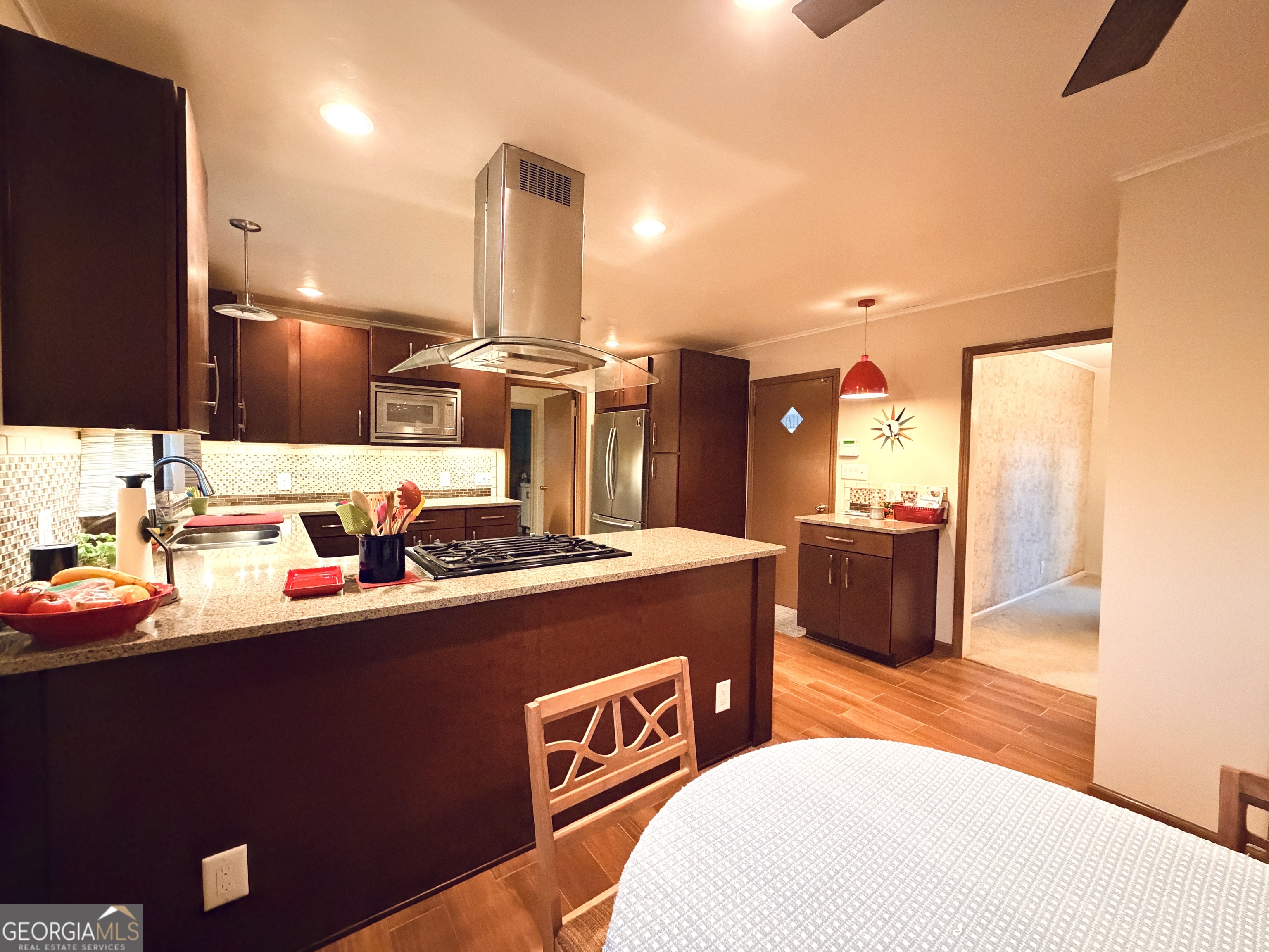 1701 Cedarwood Road Milledgeville, GA 31061 - Photo 14 of 40 a kitchen with stainless steel appliances a sink stove and refrigerator
