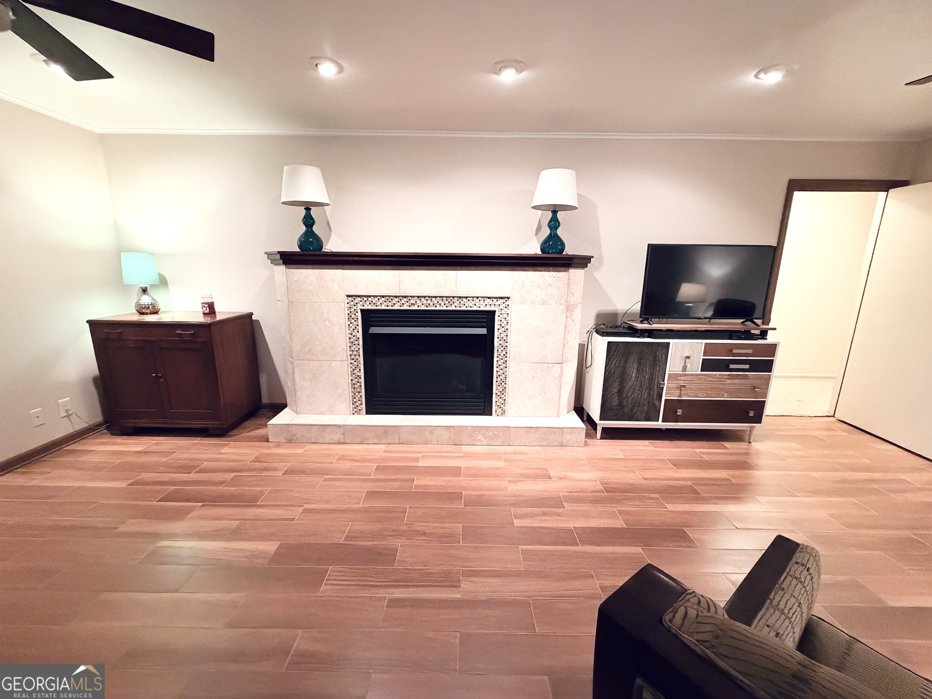 1701 Cedarwood Road Milledgeville, GA 31061 - Photo 16 of 40 a living room with furniture fireplace and flat screen tv
