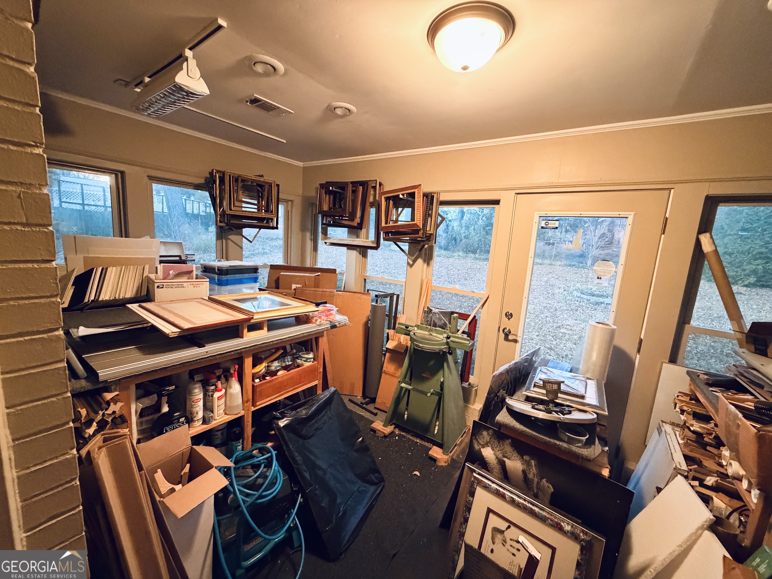 1701 Cedarwood Road Milledgeville, GA 31061 - Photo 18 of 40 a work room with furniture and wooden floor