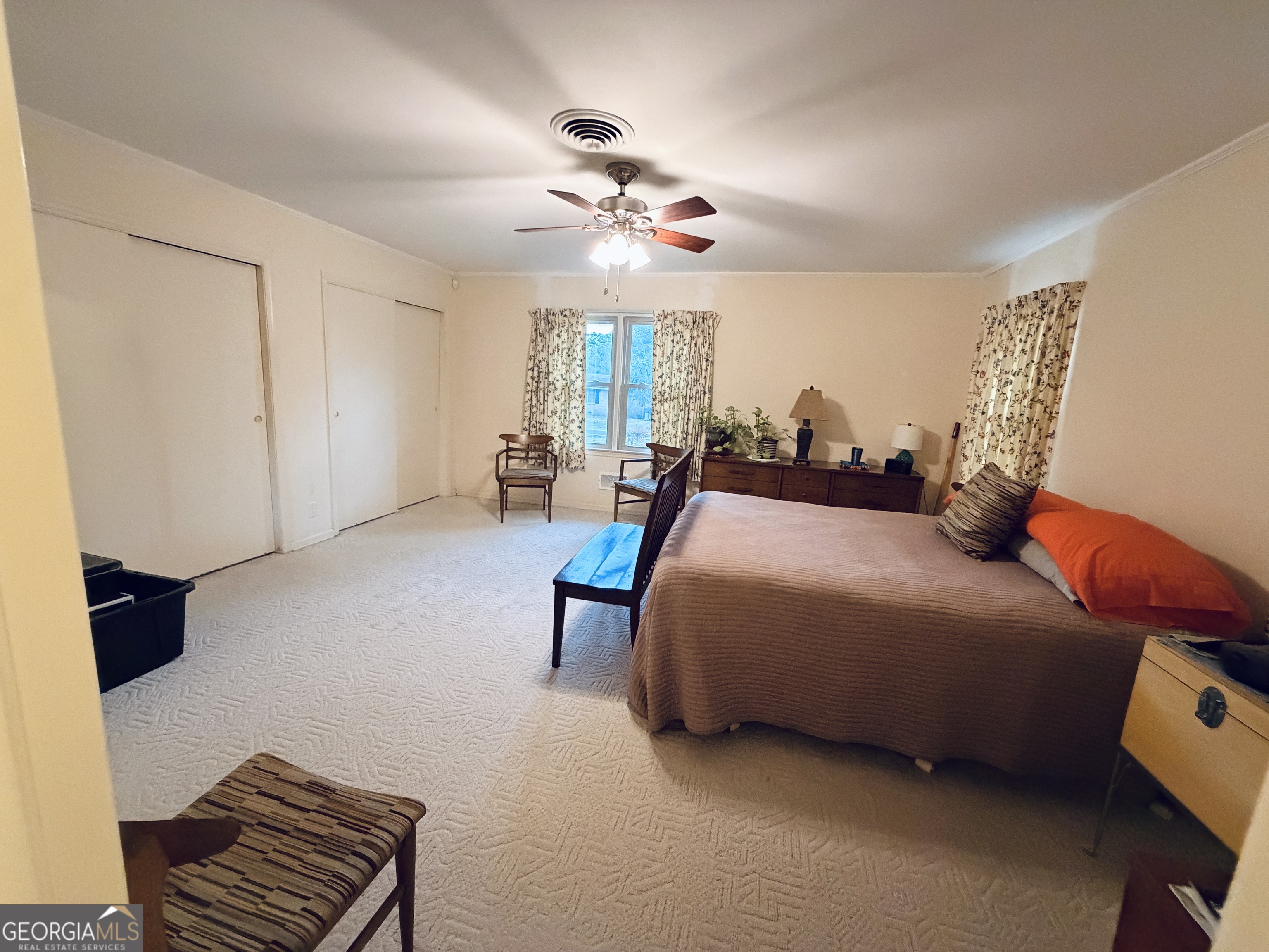 1701 Cedarwood Road Milledgeville, GA 31061 - Photo 20 of 40 a bedroom with furniture and a chandelier