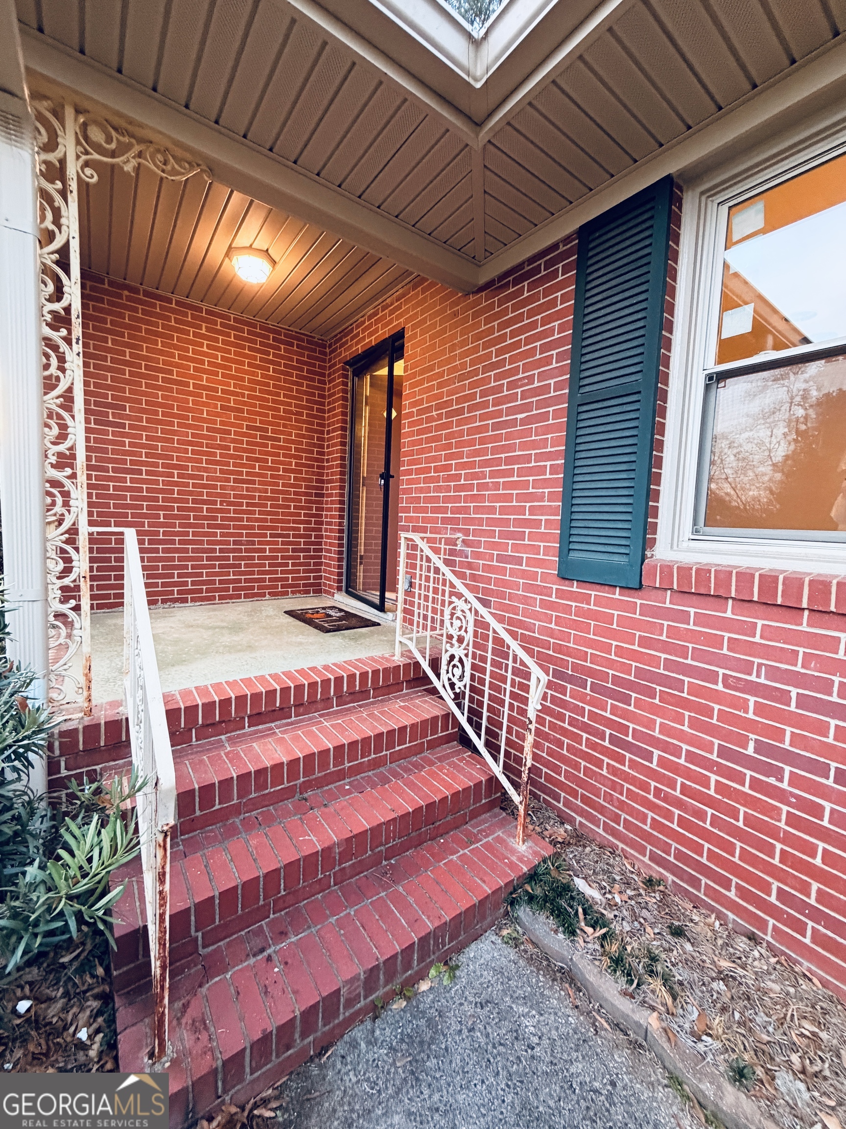 1701 Cedarwood Road Milledgeville, GA 31061 - Photo 2 of 40 a view of a wooden door with a bench