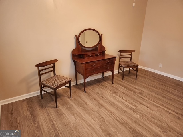 1701 Cedarwood Road Milledgeville, GA 31061 - Photo 21 of 40 a view of a workspace room with wooden floor and furniture