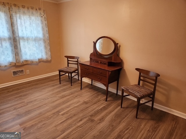 1701 Cedarwood Road Milledgeville, GA 31061 - Photo 23 of 40 a living room with furniture and a wooden floor