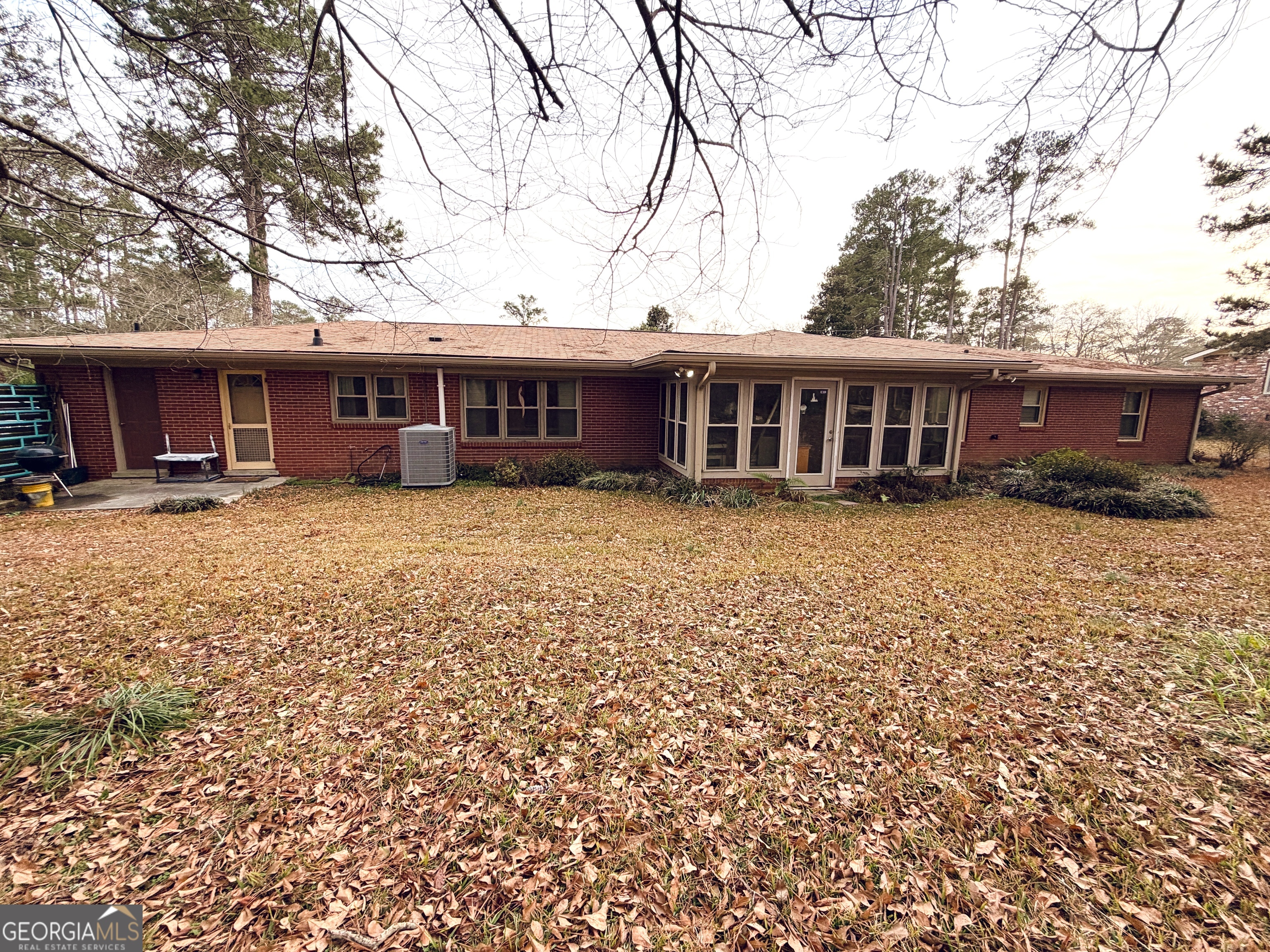1701 Cedarwood Road Milledgeville, GA 31061 - Photo 5 of 40 front view of a house with a yard