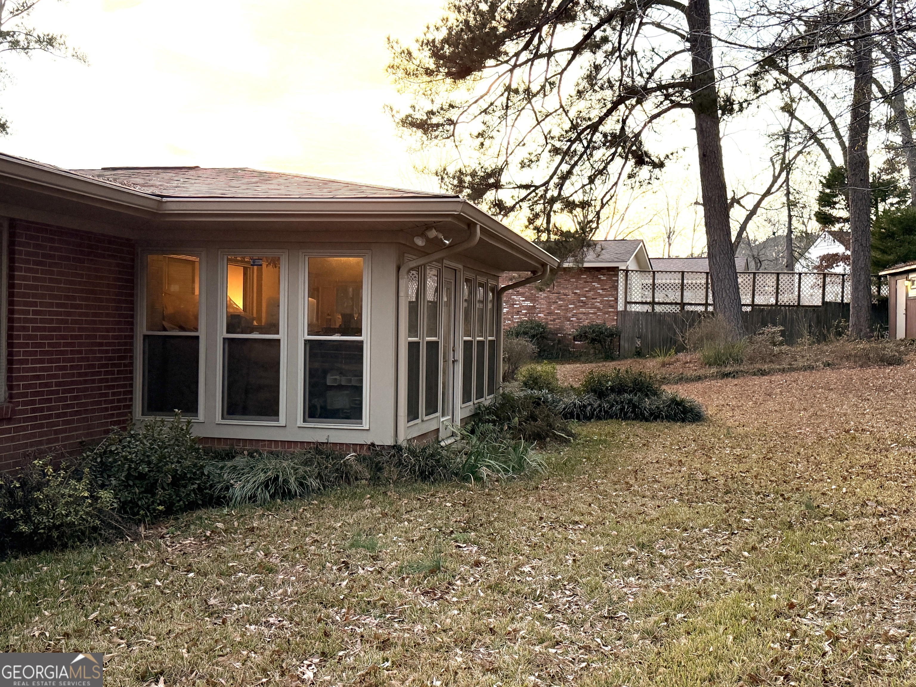 1701 Cedarwood Road Milledgeville, GA 31061 - Photo 7 of 40 a view of a house with a yard plants and large tree