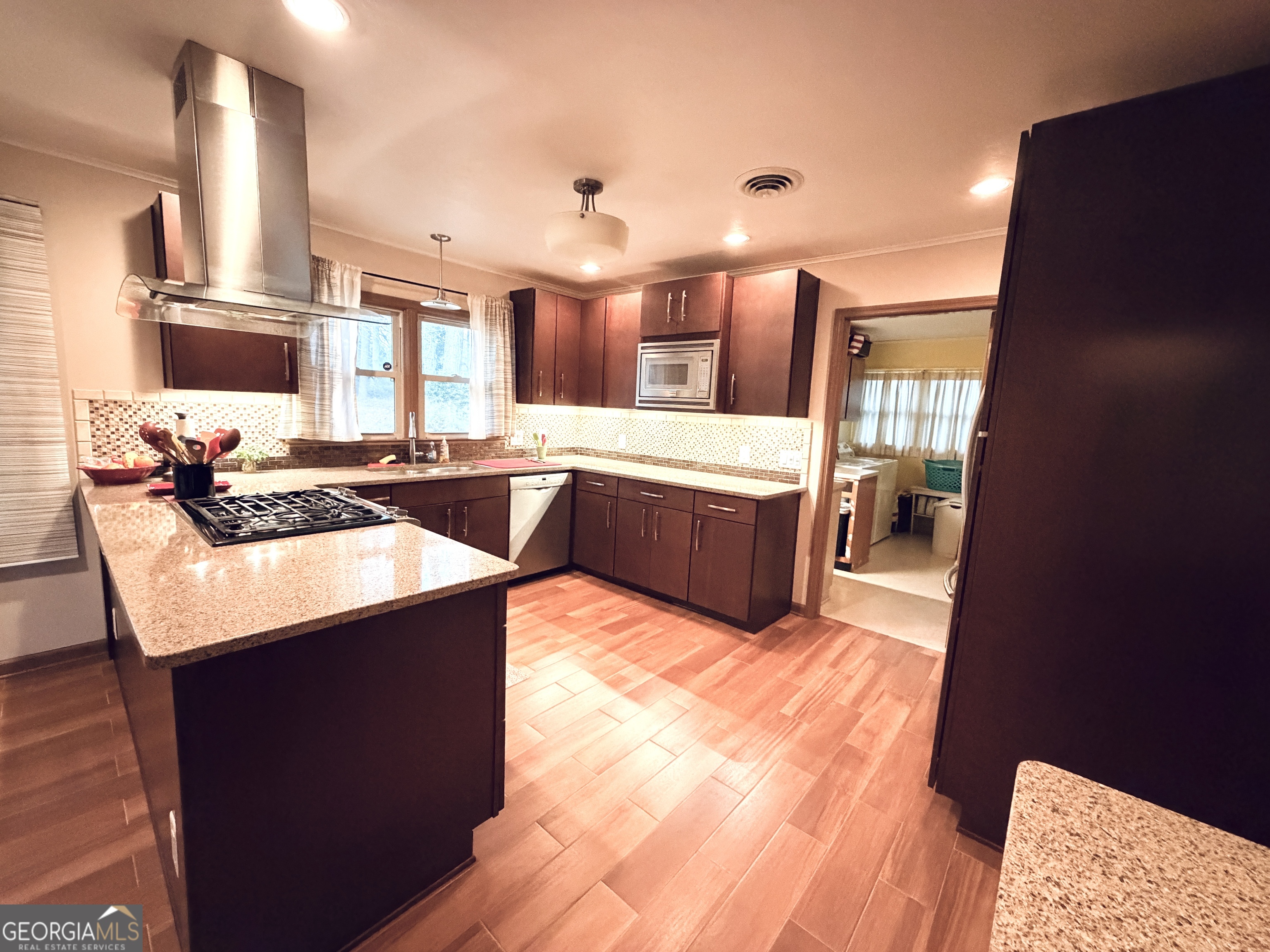 1701 Cedarwood Road Milledgeville, GA 31061 - Photo 8 of 40 a kitchen with granite countertop a sink and stove