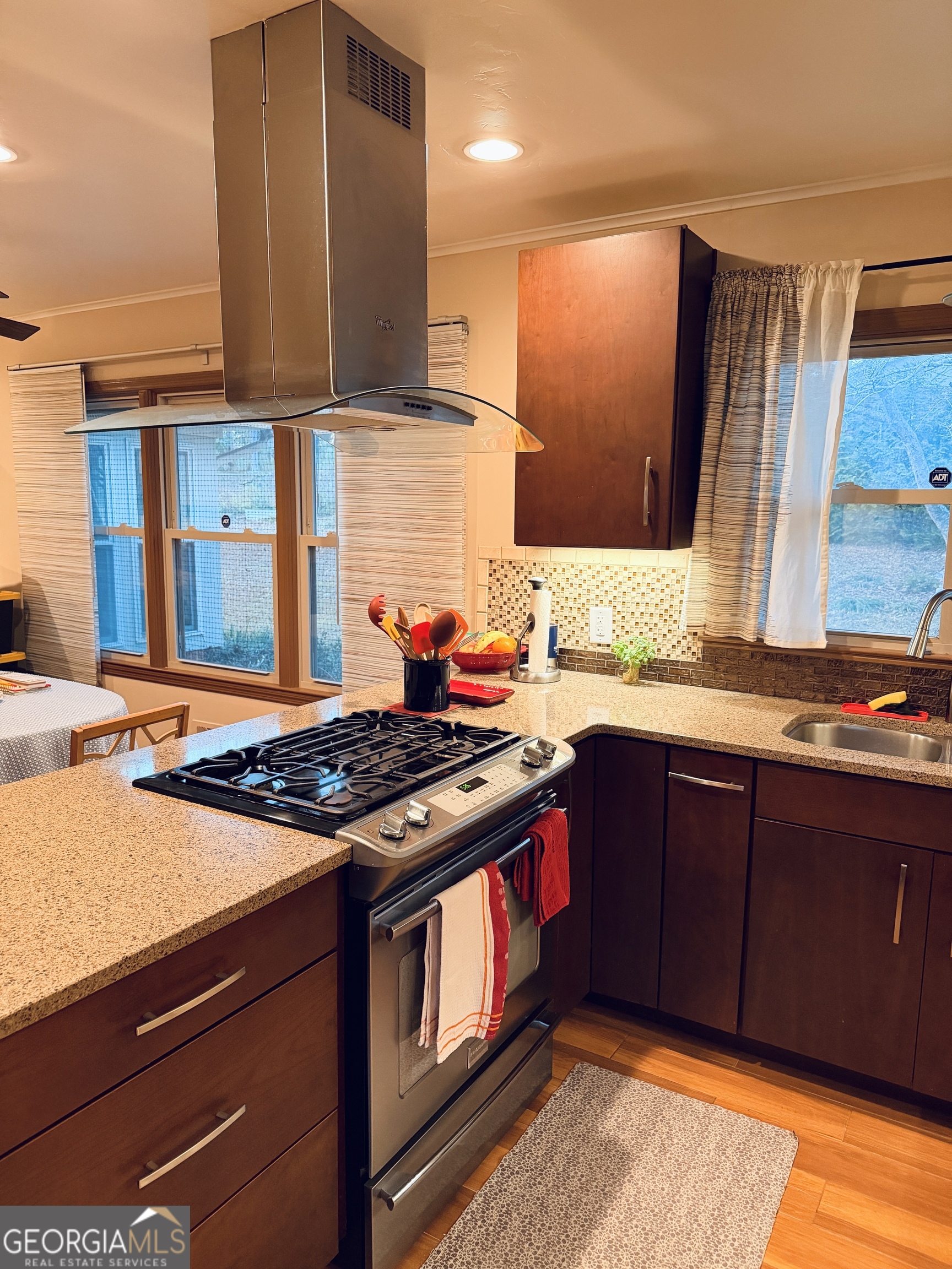 1701 Cedarwood Road Milledgeville, GA 31061 - Photo 10 of 40 a kitchen with stainless steel appliances granite countertop a stove a sink and a microwave