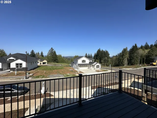 a view of a balcony with wooden fence