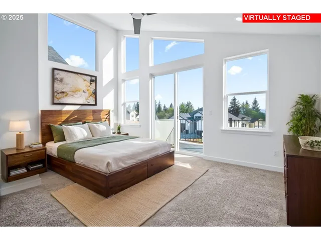 a spacious bedroom with a large bed and a window