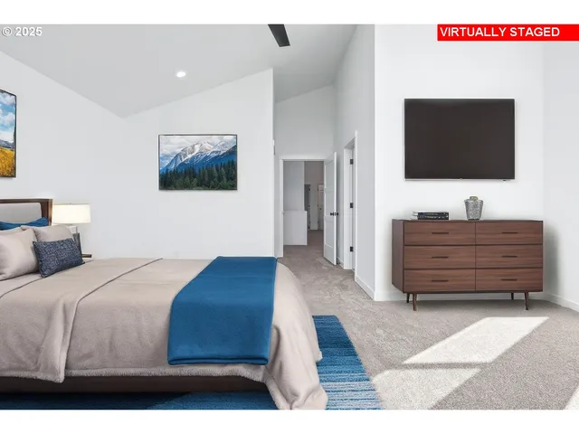 a living room with couches and a flat screen tv