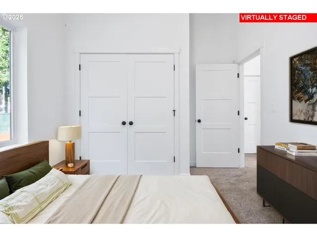 a bedroom with a bed and a cabinets