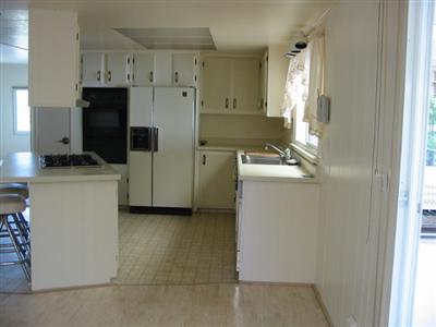 391 Bryce Canyon Road, Unit 391 San Rafael, CA 94903 - Photo 3 of 4 a utility room with cabinets washer and dryer