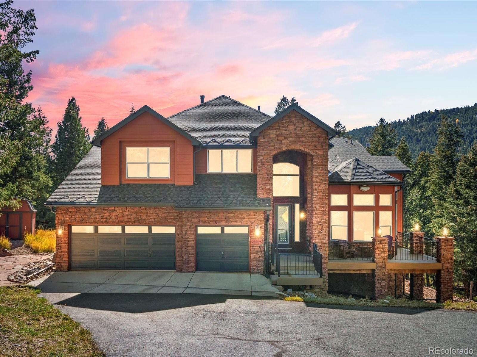 20906 Horse-Bit Way Morrison, CO 80465 - Photo 1 of 49 a front view of a house