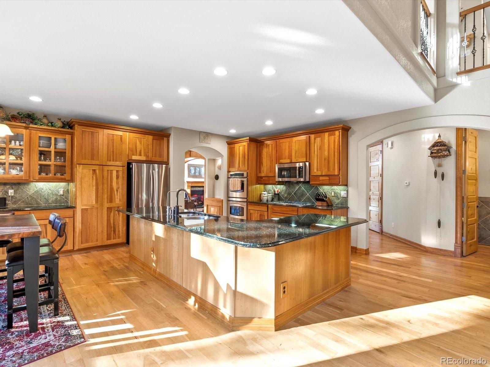 20906 Horse-Bit Way Morrison, CO 80465 - Photo 19 of 49 a view of a living room and kitchen