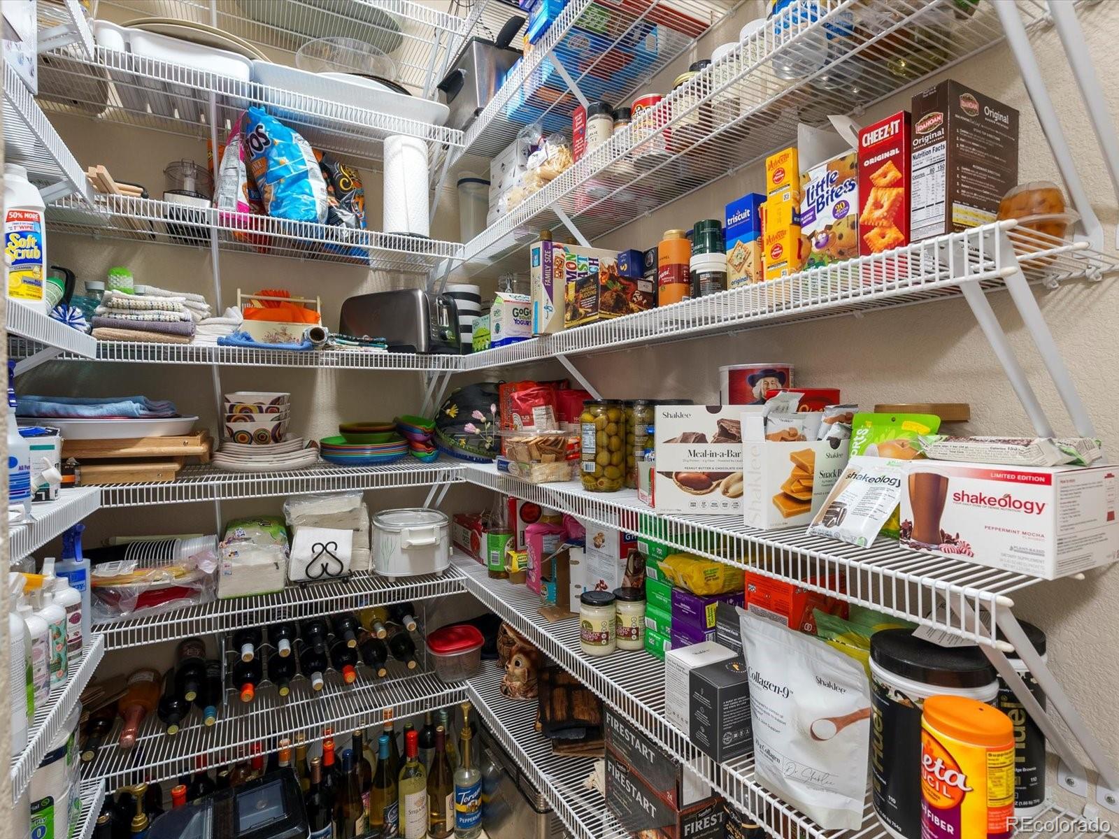 20906 Horse-Bit Way Morrison, CO 80465 - Photo 26 of 49 a store room with stainless steel appliances and storage