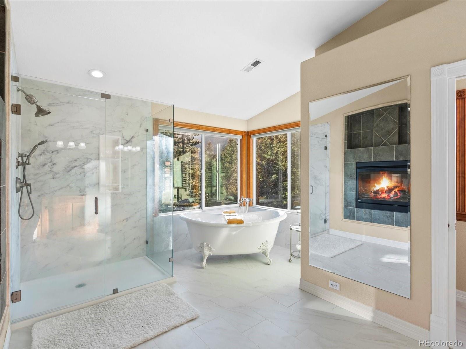 20906 Horse-Bit Way Morrison, CO 80465 - Photo 32 of 49 a outdoor space with furniture and a fireplace