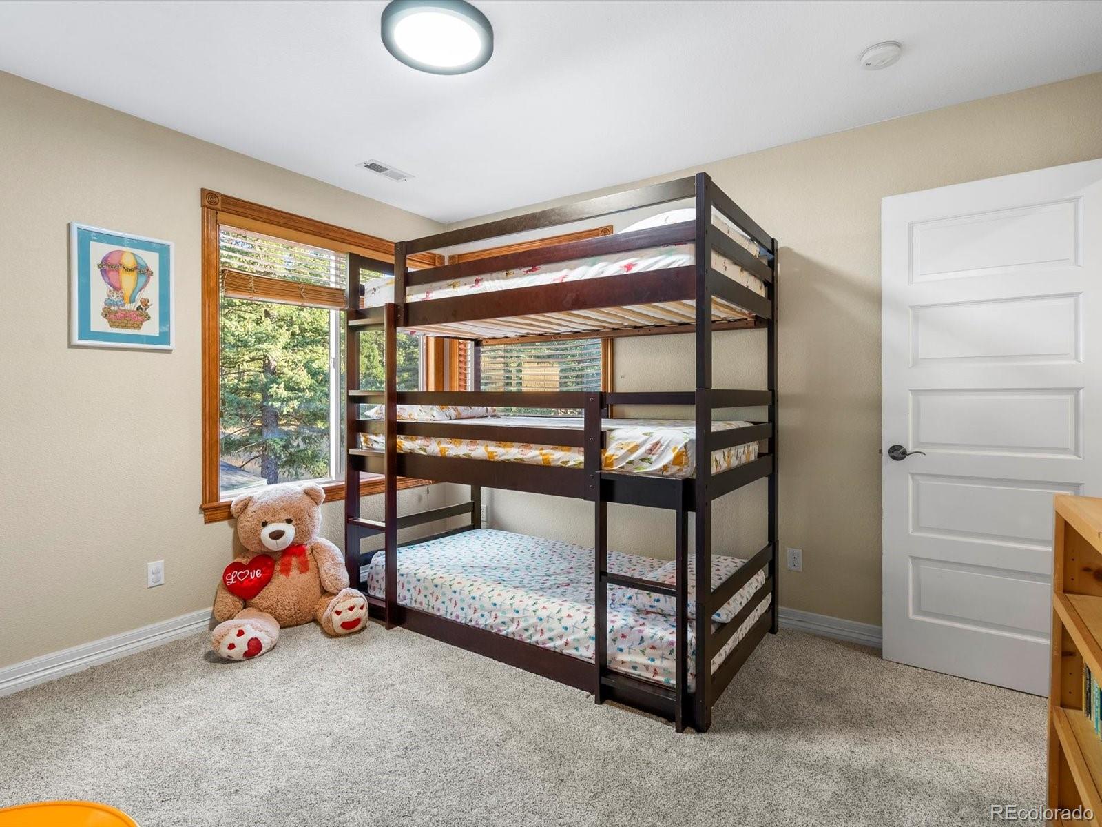 20906 Horse-Bit Way Morrison, CO 80465 - Photo 36 of 49 a view of a livingroom with furniture and a window