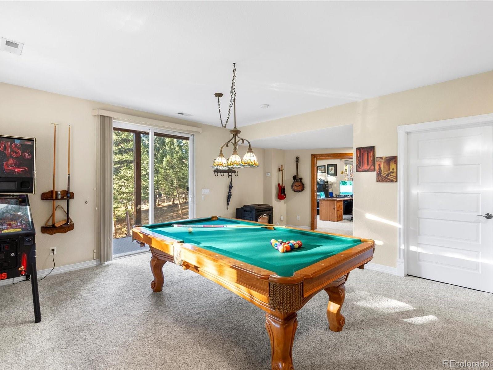 20906 Horse-Bit Way Morrison, CO 80465 - Photo 41 of 49 a room with pool table and windows
