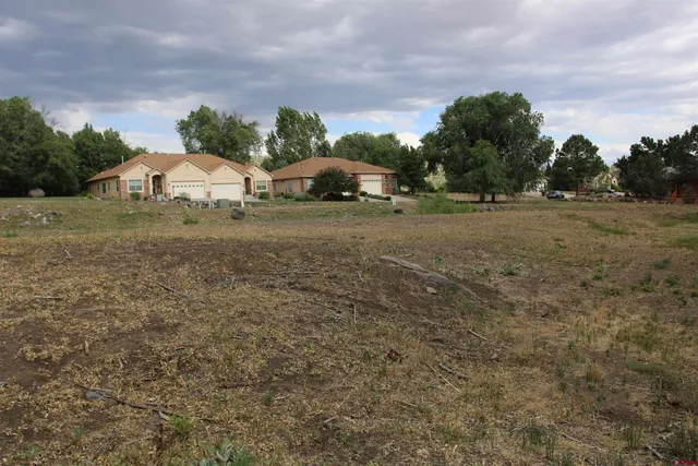 a view of a lake with a yard