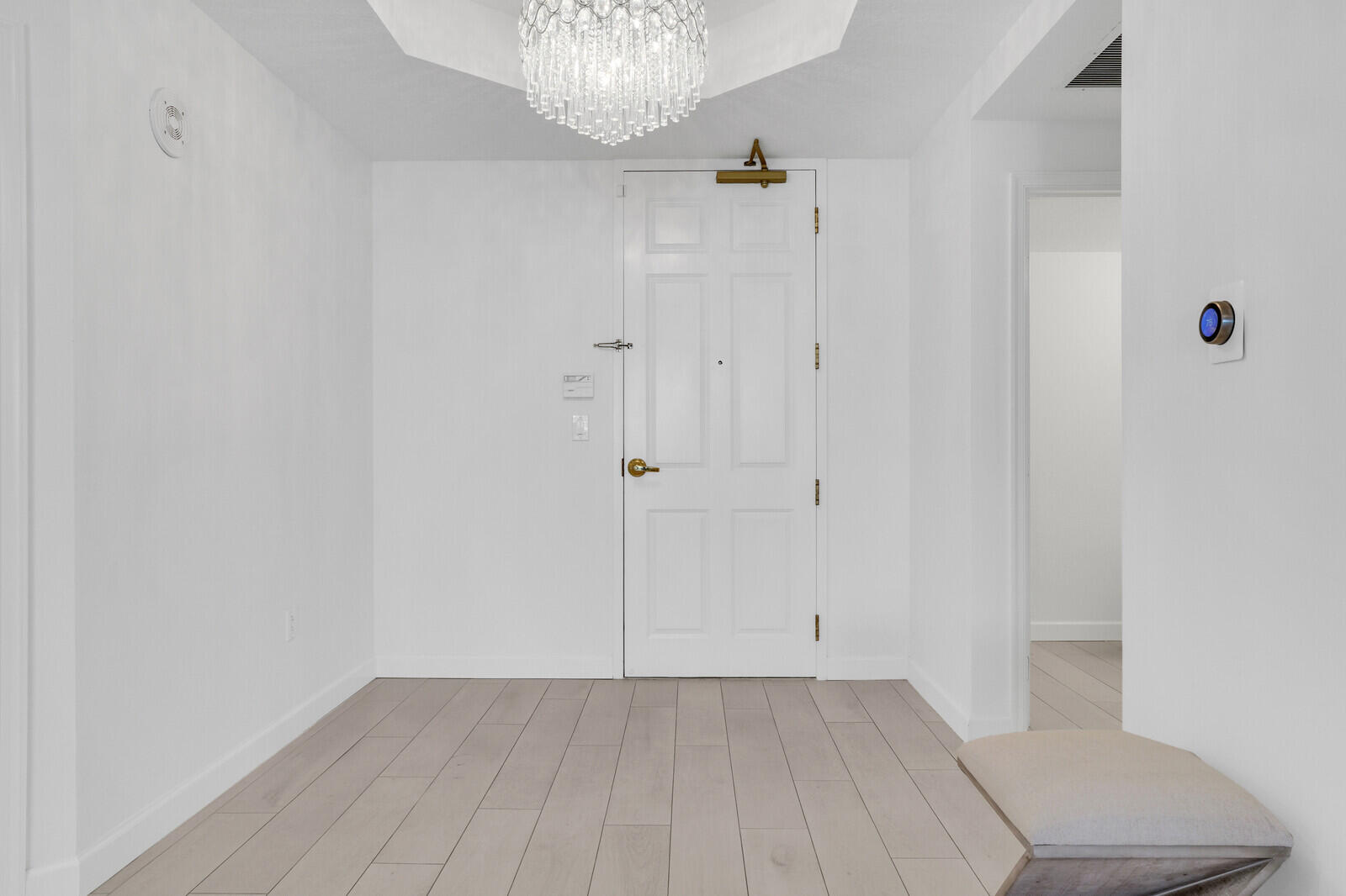 120 Ocean Grande Boulevard, Unit 2 Jupiter, FL 33477 - Photo 18 of 47 a view of an empty room with wooden floor