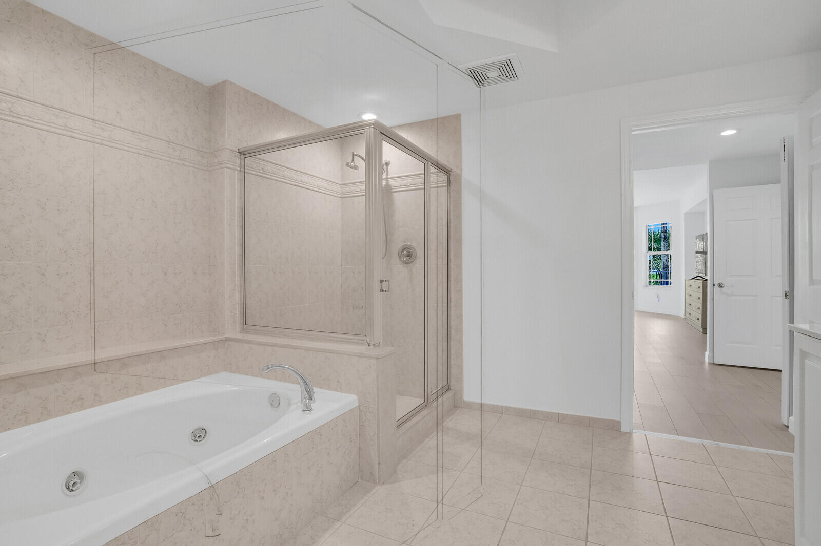 120 Ocean Grande Boulevard, Unit 2 Jupiter, FL 33477 - Photo 25 of 47 a bathroom with a bathtub and a shower