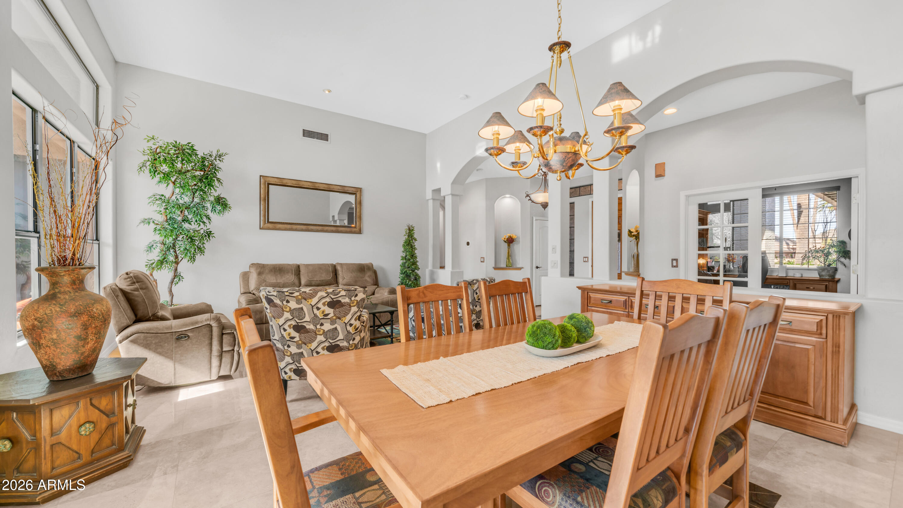 4055 North Recker Road, Unit 50 Mesa, AZ 85215 - Photo 19 of 77 a view of a dining room with furniture and a large mirror