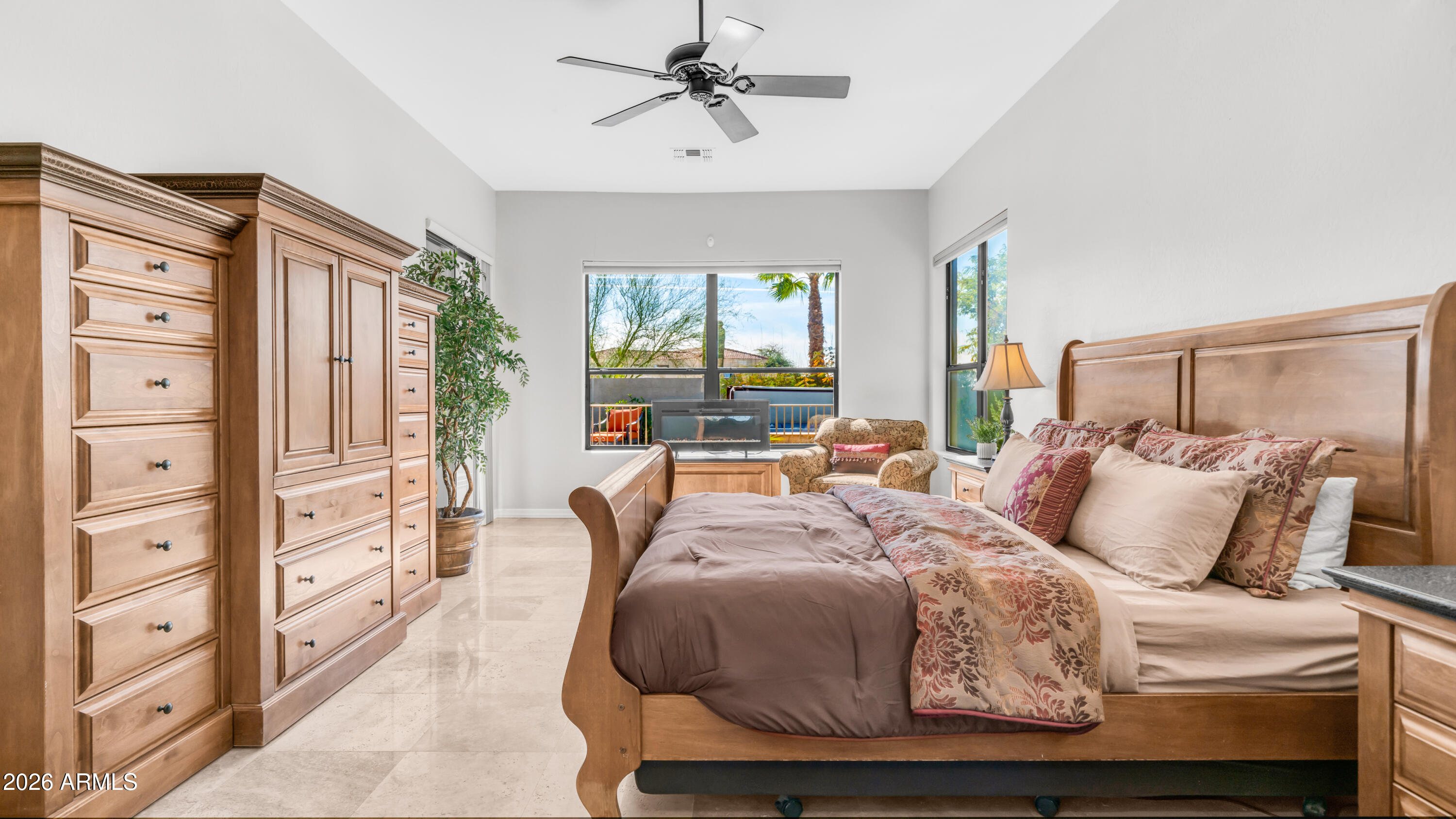 4055 North Recker Road, Unit 50 Mesa, AZ 85215 - Photo 30 of 77 a bedroom with a bed and wooden floor