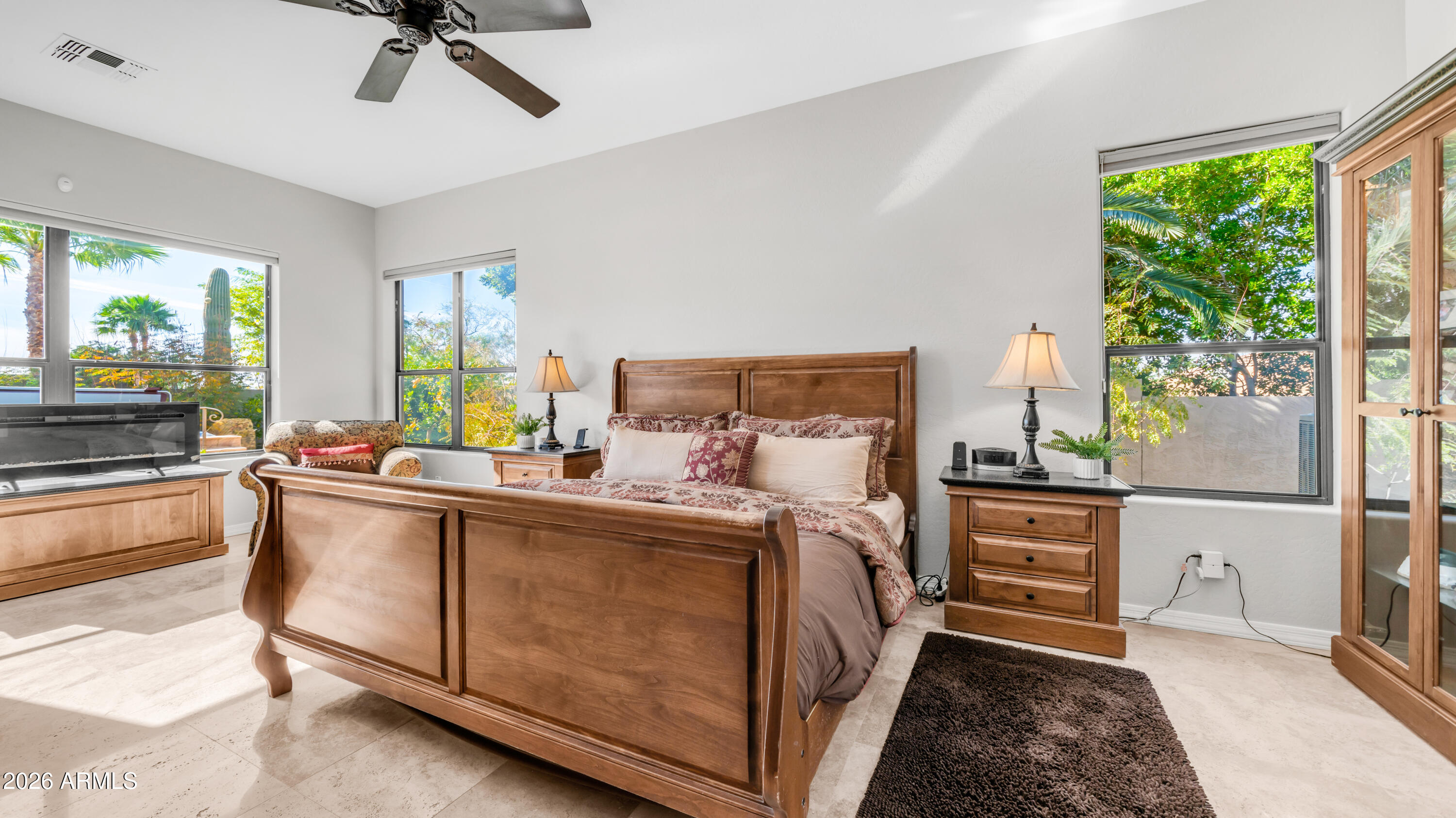 4055 North Recker Road, Unit 50 Mesa, AZ 85215 - Photo 31 of 77 a kitchen with stainless steel appliances granite countertop a stove a sink and a refrigerator