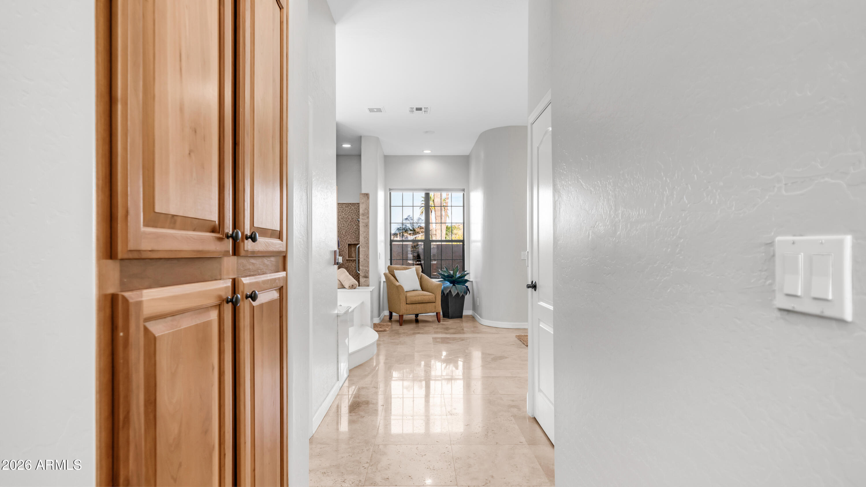 4055 North Recker Road, Unit 50 Mesa, AZ 85215 - Photo 33 of 77 a view of a hallway with furniture and floor to ceiling window