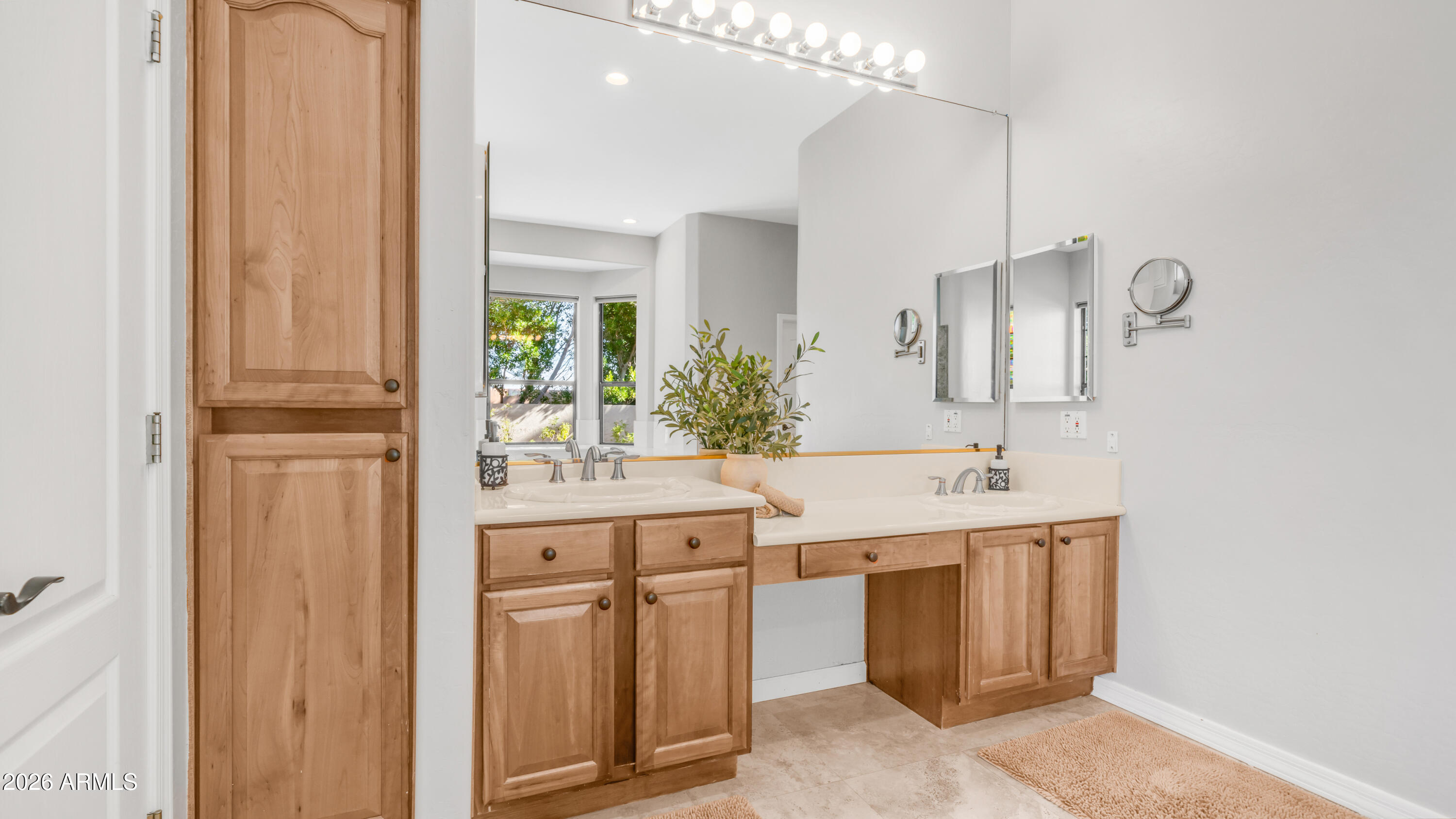 4055 North Recker Road, Unit 50 Mesa, AZ 85215 - Photo 38 of 77 a spacious bathroom with a double vanity sink a mirror and next to a window