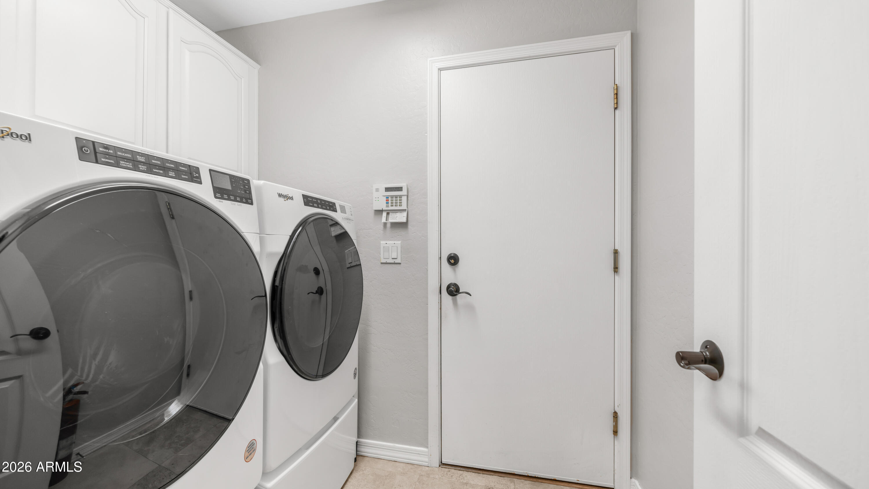 4055 North Recker Road, Unit 50 Mesa, AZ 85215 - Photo 43 of 77 a utility room with dryer and washer