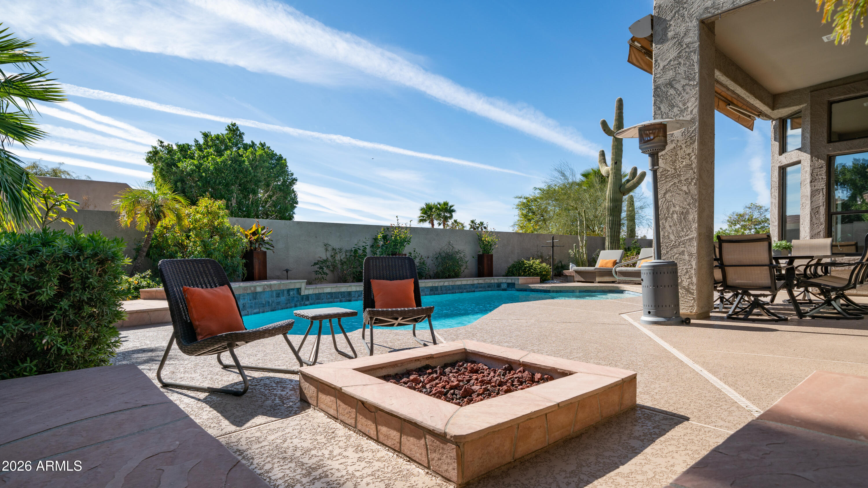 4055 North Recker Road, Unit 50 Mesa, AZ 85215 - Photo 49 of 77 a view of a patio with couches and potted plants