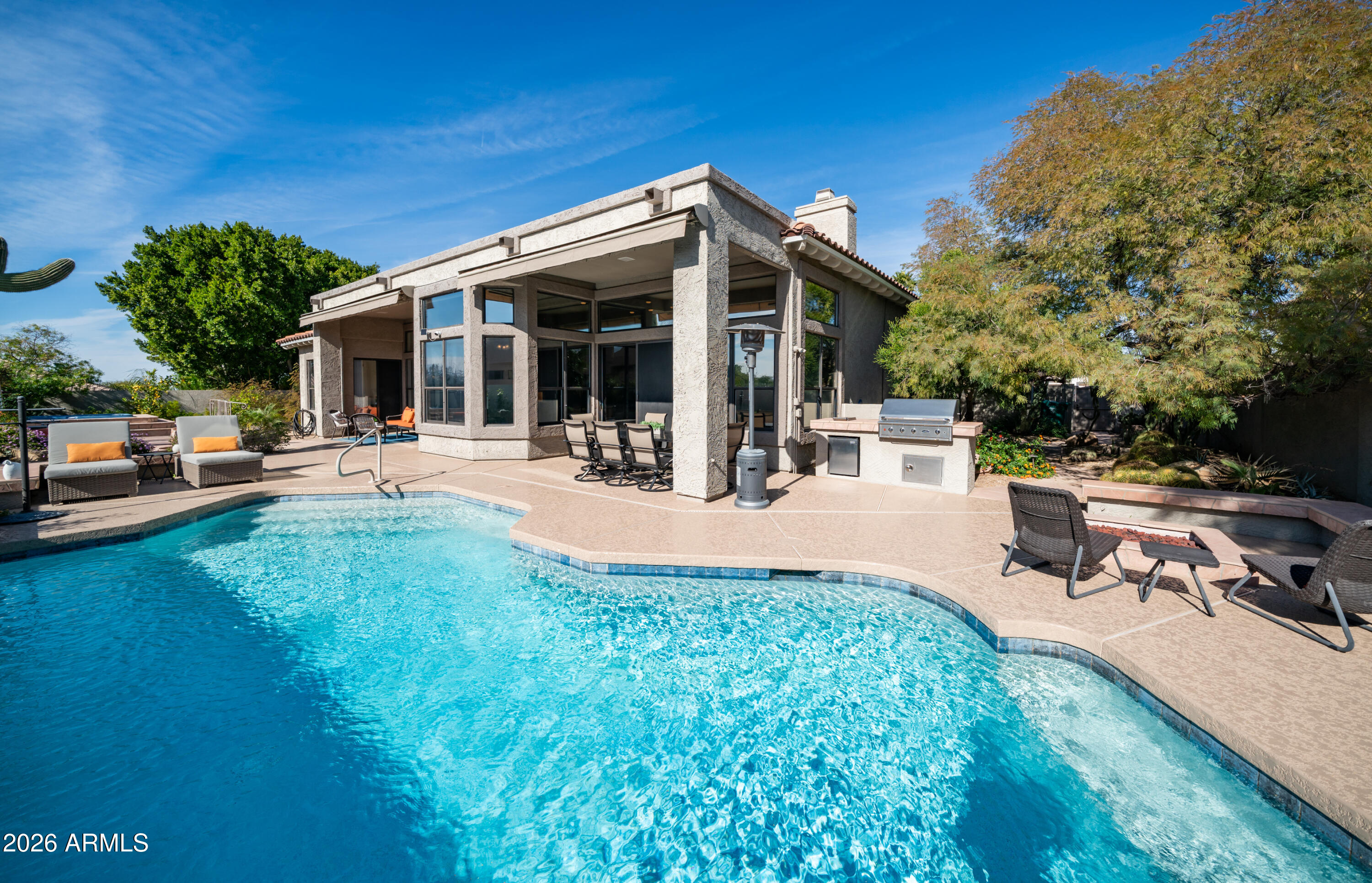 4055 North Recker Road, Unit 50 Mesa, AZ 85215 - Photo 50 of 77 a view of a house with swimming pool and sitting area