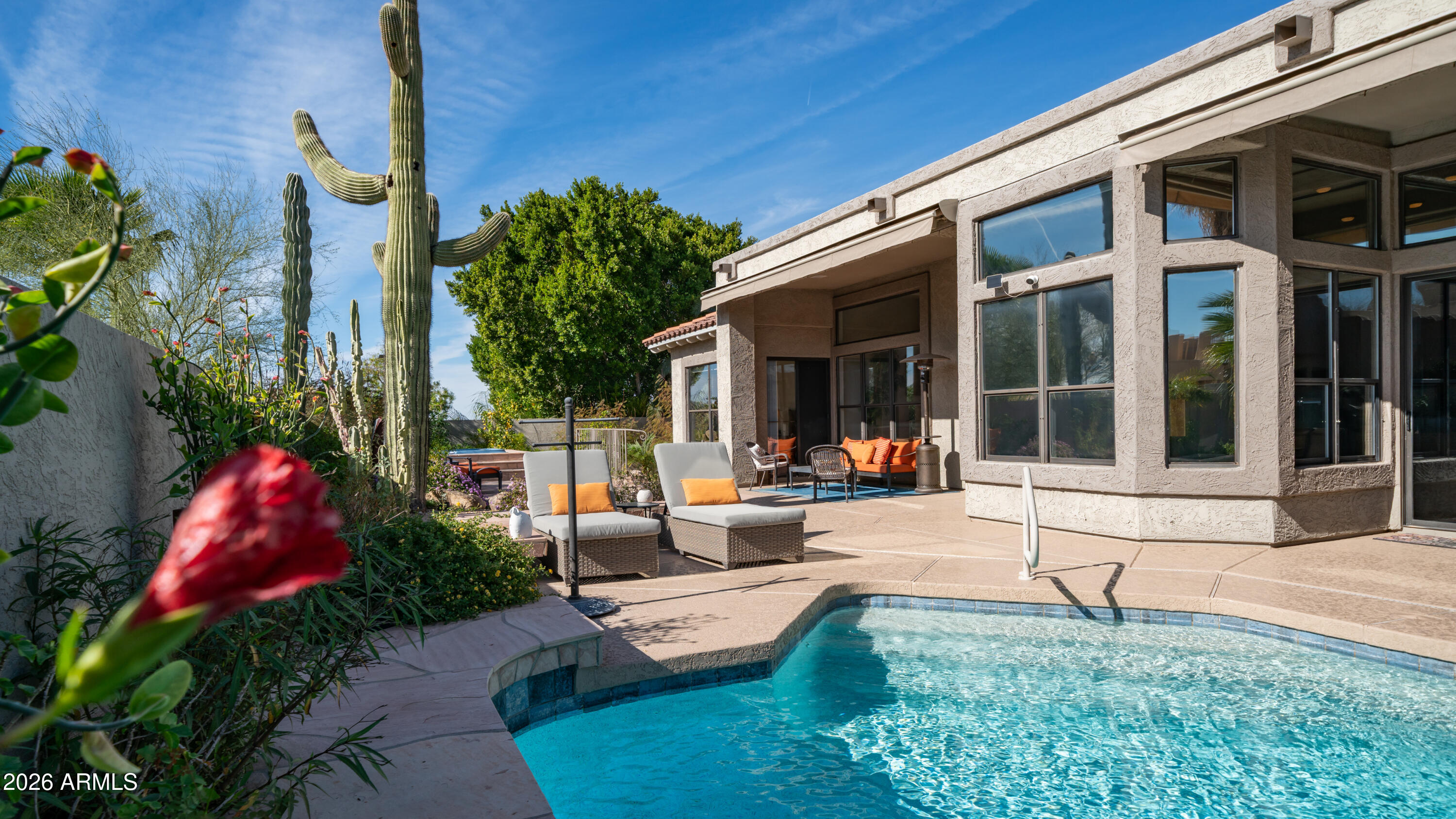 4055 North Recker Road, Unit 50 Mesa, AZ 85215 - Photo 51 of 77 a view of a house with backyard sitting area and garden
